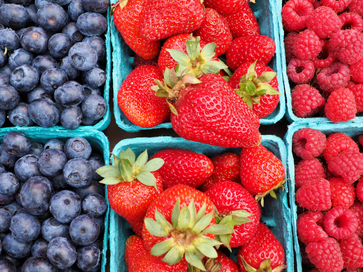fresh organic blueberries strawberries raspberries in baskets at eugene saturday market